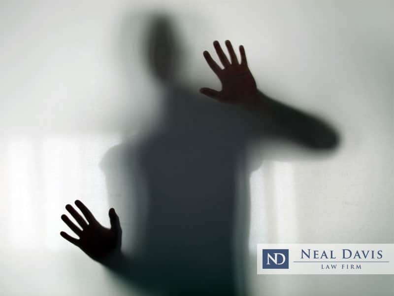 shadowy figure behind glass: Neal Davis Child Sex Offenses blog